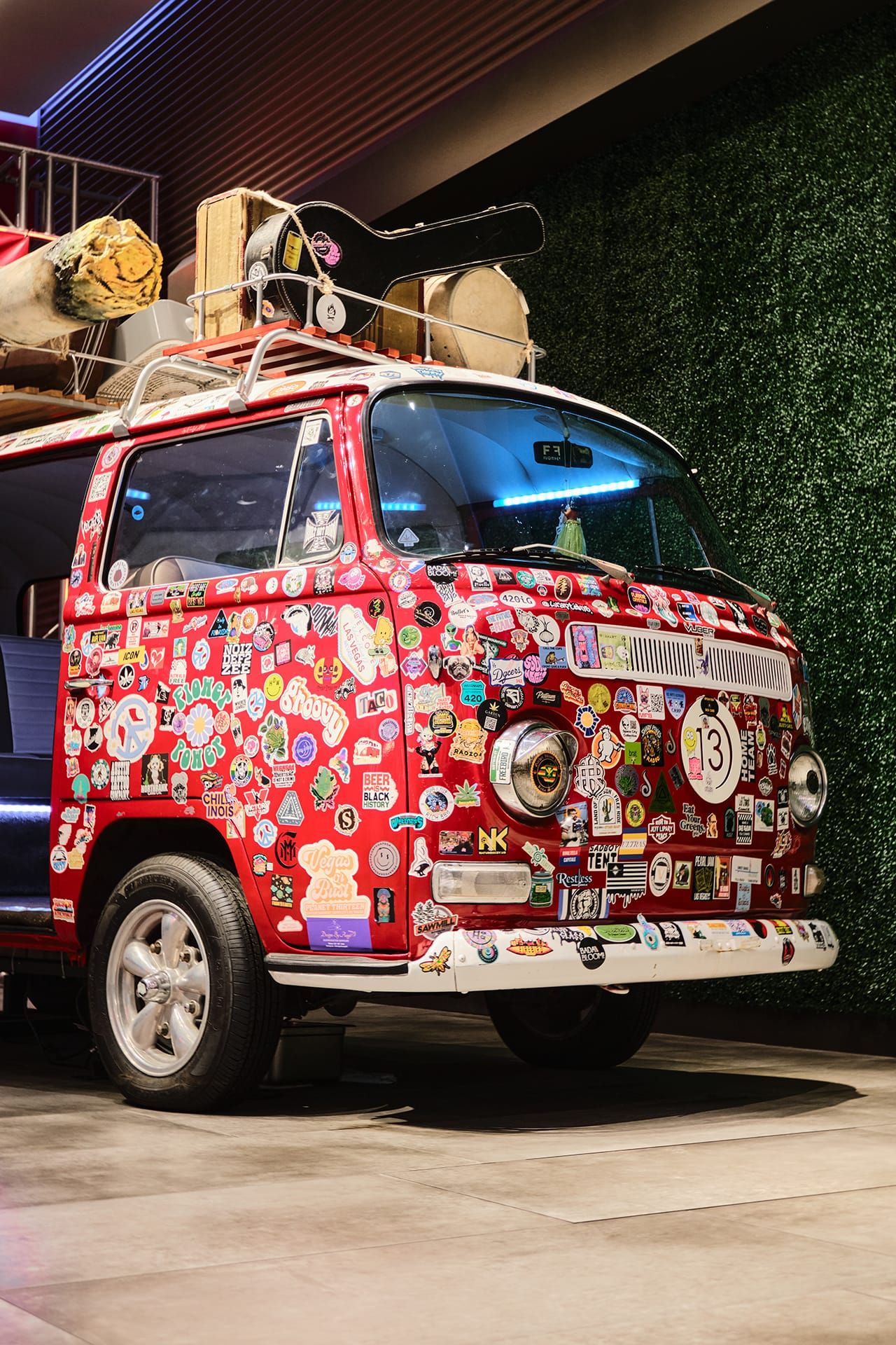 The sticker-covered red van inside DAZED!